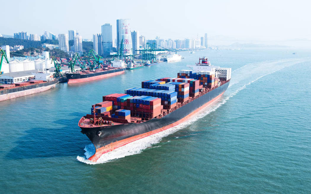 Large container ship arriving in port.