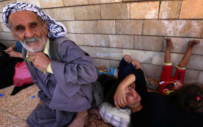 Iraqi Christians who fled violence in Nineveh, rest at the Saint-Joseph church in the Kurdish city of Arbil.