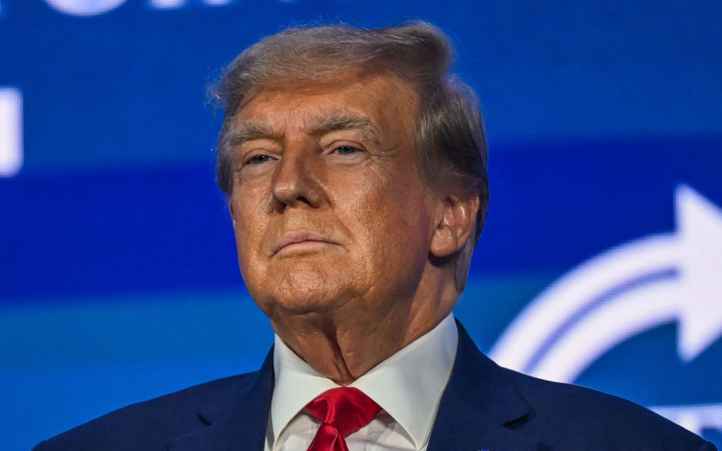 (FILES) Former US President and 2024 presidential hopeful Donald Trump speaks at the Turning Point Action USA conference in West Palm Beach, Florida, on July 15, 2023. Former US president Donald Trump faced fresh charges July 27, 2023 alleging that he attempted to obstruct the investigation into the mishandling of top secret documents by conspiring to delete surveillance footage at his Mar-a-Lago property in Florida. (Photo by GIORGIO VIERA / AFP)
