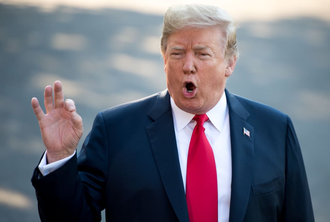 US President Donald Trump speaks to the media as he walks to Marine One prior to departure from the South Lawn of the White House in Washington, DC, July 10, 2018, as they travel on a week-long trip to Europe, with stops in Brussels, London, Scotland and Helsinki.