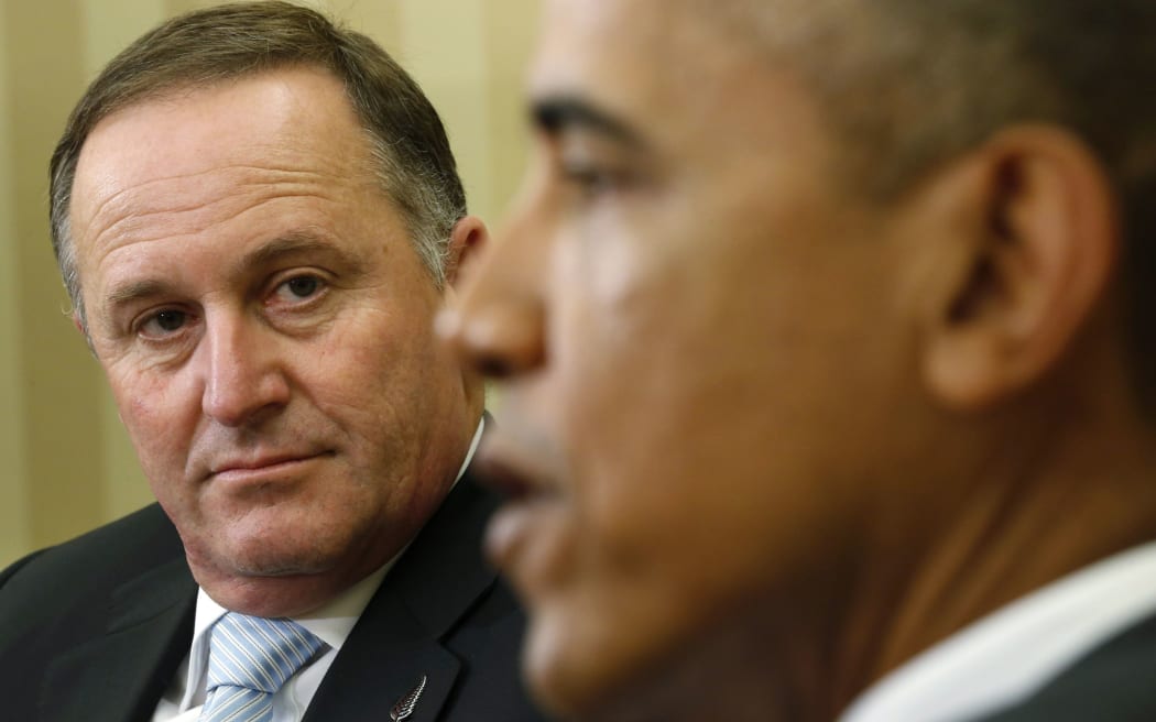 U.S. President Barack Obama (R) speaks as New Zealand's Prime Minister John Key looks on in the Oval Office of the White House in Washington June 20, 2014.