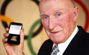 Sir Murray Halberg. Auckland Central Olympic Function to celebrate 100 years of New Zealand participation in the Olympic Games in 2009. All former Olympic athletes recieved a badge of recognition from the NZ Olympic Commitee.