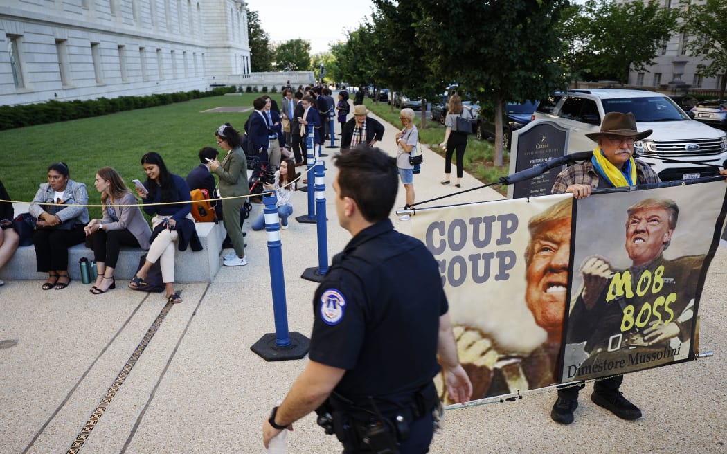 WASHINGTON, DC - JUNE 09: People wait in line for an opportunity to attend the hearing of the Select Committee to Investigate the January 6th Attack On the U.S. Capitol at the Cannon House Office Building on June 09, 2022 in Washington, DC. The bipartisan committee, which has been gathering evidence related to the January 6 attack at the U.S. Capitol for almost a year, will present its findings in a series of televised hearings. On January 6th, 2021, supporters of President Donald Trump attacked the U.S. Capitol Building in an attempt to disrupt a congressional vote to confirm the electoral college win for Joe Biden.   Chip Somodevilla/Getty Images/AFP (Photo by CHIP SOMODEVILLA / GETTY IMAGES NORTH AMERICA / Getty Images via AFP)