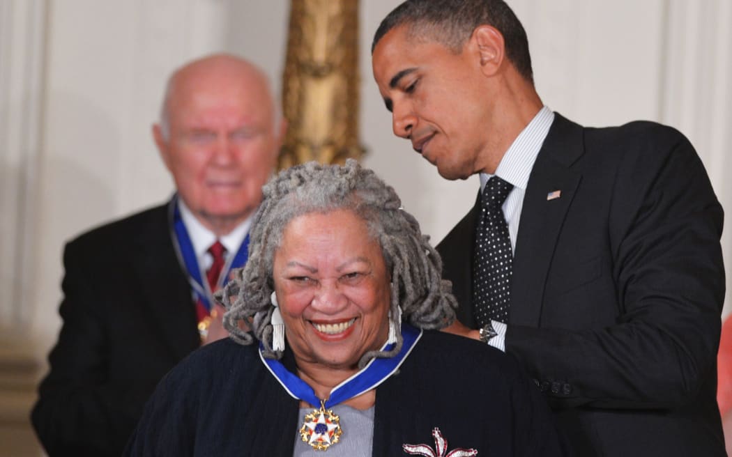 US President Barack Obama presents the Presidential Medal of Freedom to author Toni Morrison on May 29, 2012 during a ceremony in the East Room of the White House in Washington,DC.