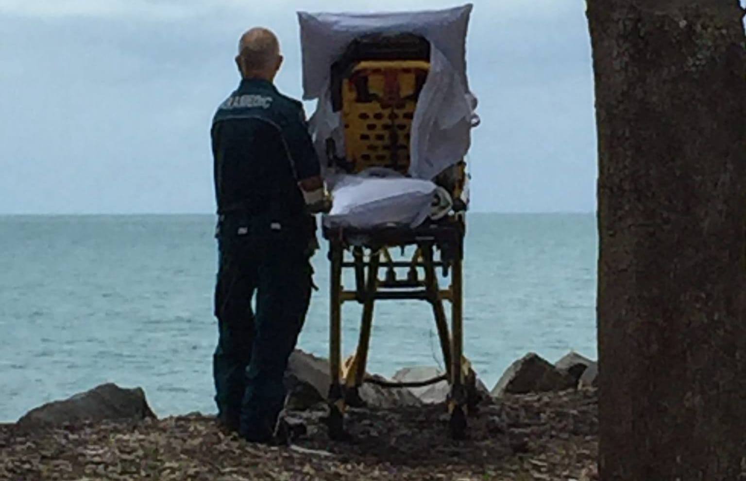 Queensland Ambulance Service paramedics brought the terminally ill woman to see the beach again.