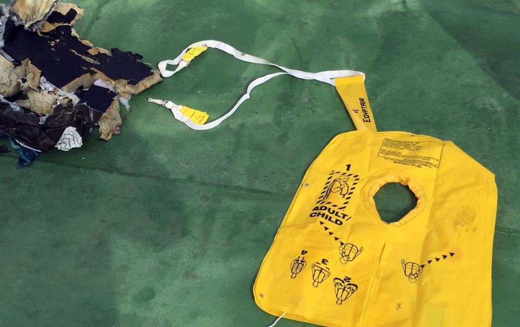 A picture uploaded on the official Facebook page of the Egyptian military spokesperson on May 21, 2016 and taken from an undisclosed location reportedly shows some debris that the search teams found in the sea after the EgyptAir Airbus A320 crashed in the Mediterranean.