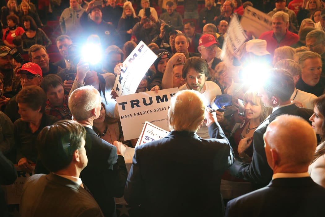 Republican presidential candidate Donald Trump greets people at a campaign rally at the Sioux City Orpheum Theatre in Sioux City, Iowa on 31 January 2016.