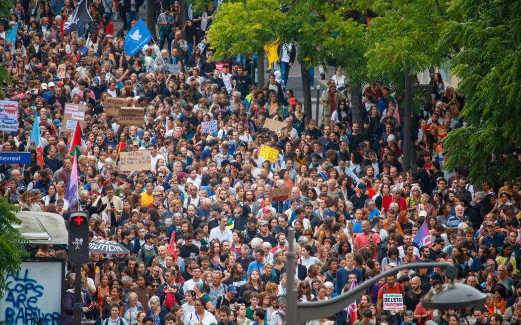 The procession and the crowd during the demonstration of the left-wing forces against the nomination of Michel Barnier, in Paris, France on September 7, 2024.
Le cortege et la foule lors de la manifestation des forces de gauche contre la nomination de Michel Barnier, a Paris, France le 7 septembre 2024. (Photo by AUGUSTIN PASQUINI / Hans Lucas via AFP)