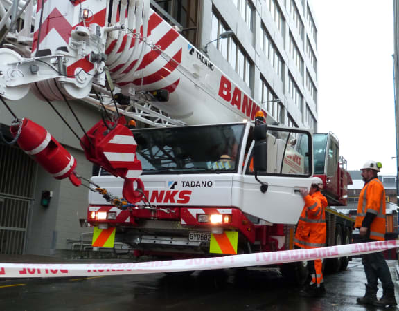 A crane has been brought in to help demolish the lift shaft.