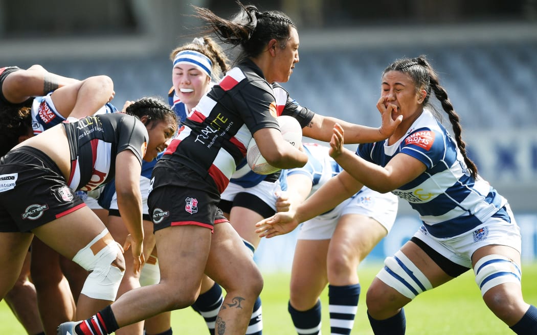 Harono Te Iringa fends off Liana Mikaele-Tuu in the Farah Palmer Cup match between Auckland Storm and Counties Manukau at Eden Park, Auckland, New Zealand.  Sunday 20 September 2020.