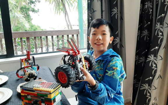 11 year old Ding Ding shows off his Lego creations.