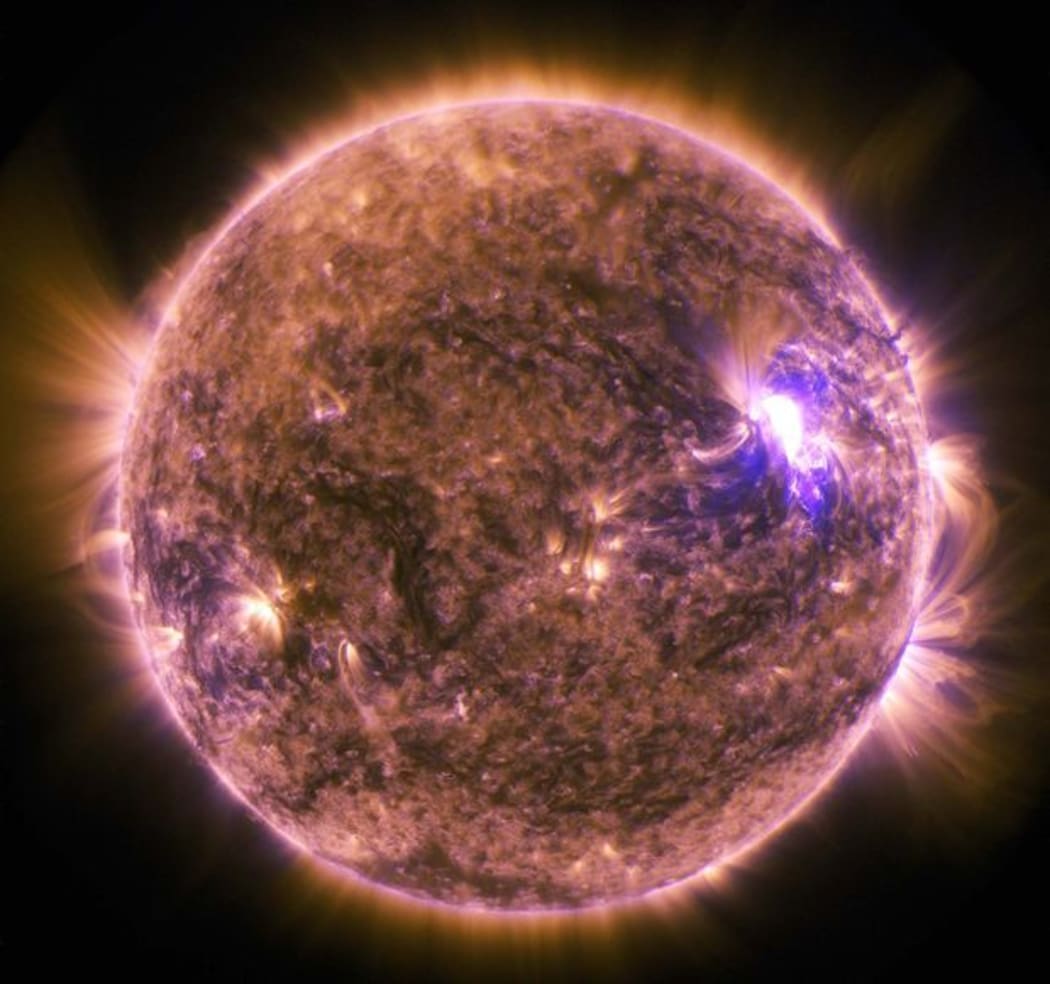 This NASA image obtained June 27, 2015 shows The sun as it emitted a mid-level solar flare, an M7.9-class, peaking at 4:16 a.m. EDT on June 25, 2015.