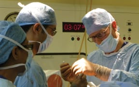 Professor Steven Gill and his team in theatre