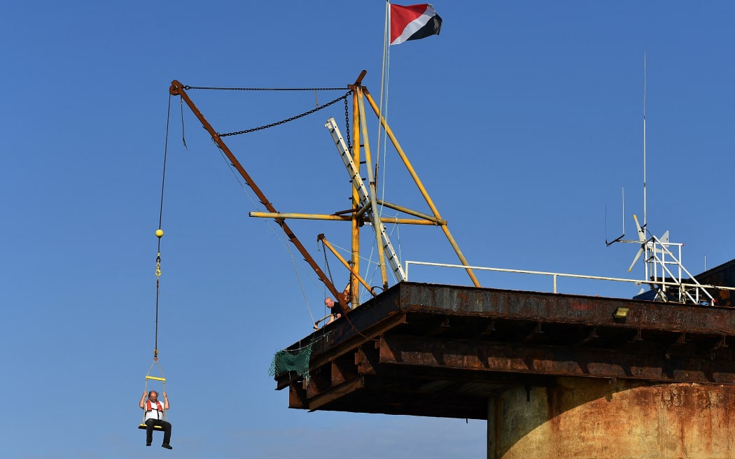 Chief Engineer and Head of Homeland Security Michael Barington is winched onto the Principality of Sealand, some 11 kilometres off the coast of southeast England, on September 16, 2021.