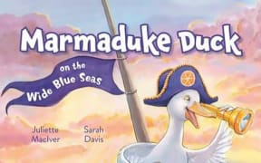 Book cover for "Marmaduke Duck on the Wide Blue Seas". A happy white duck sits in a ship's crow's nest and looks out to sea through a small telescope.