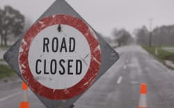SH60 closed off north of Tākaka. Shortly up the road is the bridge across the Tākaka River to Collingwood.
