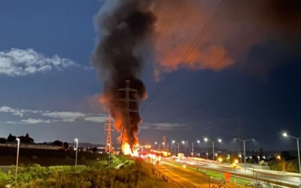 Explosions and a huge plume of smoke emitted from a truck carrying hazardous substances that burst into flames on Auckland's Southern Motorway, on 8 March, 2023.