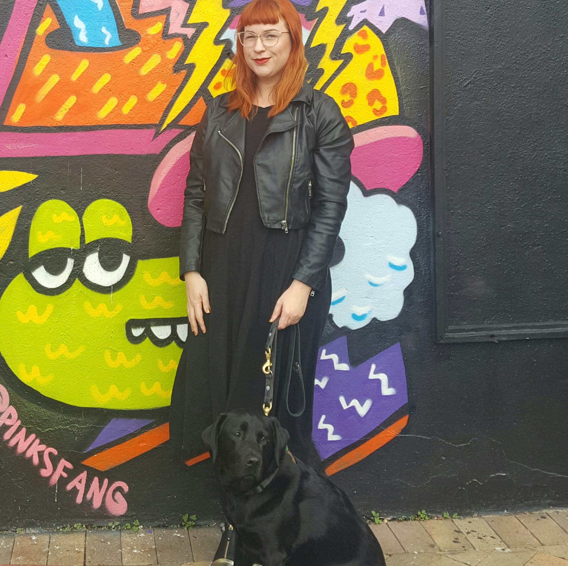 Artist Pinky Fang and guide dog Lyric.