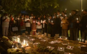 Activists mark the second anniversary of the fatal gang-rape of a Delhi student.
