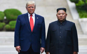 North Korea's leader Kim Jong Un poses with US President Donald Trump at the Military Demarcation Line that divides North and South Korea, in the Joint Security Area (JSA) of Panmunjom in the Demilitarized zone (DMZ) on June 30, 2019.