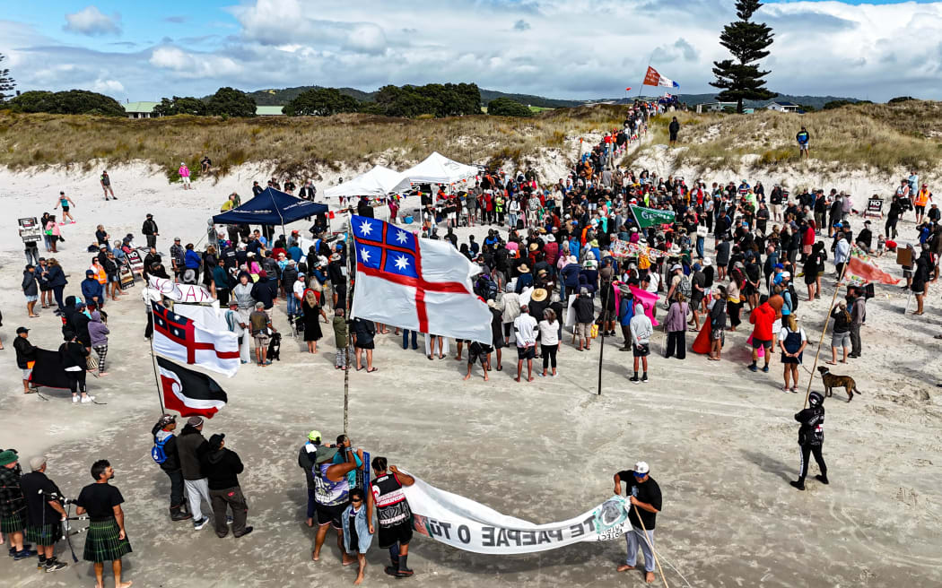 An estimated 700 people gathered on Northland’s Ruakākā Beach on Sunday to protest a proposed sand mining operation.
