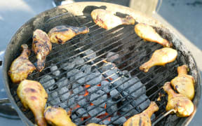 Chicken cooks on the grill during a tailgate before the NHL Stadium Series at Levi's Stadium on February 21, 2015 in Santa Clara, California