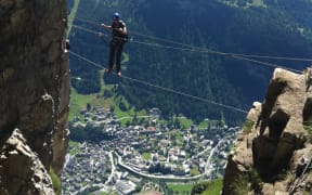 A man traverses the ferrata on the Gemmi pass.