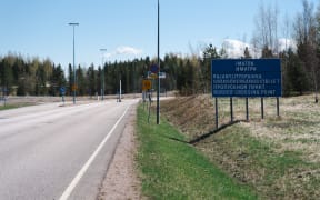A street sign announces the Finnish-Russian Imatra border crossing, in Imatra, south-eastern Finland, on 13 May, 2022.