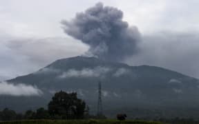 Ash continued to rise from Mount Marapi on 4 December, as seen from Batu Palano village, a day after the volcano erupted.
