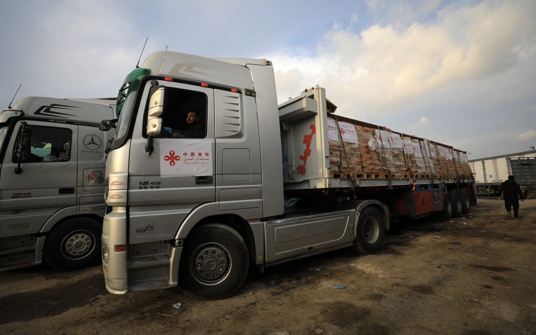 (251008) -- GAZA, Oct. 8, 2025 (Xinhua) -- A truck loaded with humanitarian aid supplies provided by China is seen on the Gaza side of the Kerem Shalom border crossing between Israel and the Gaza Strip, Dec. 17, 2023. As Hamas and Israel are meeting in Egypt over a potential ceasefire the world anxiously awaits, Gaza marked the grim second anniversary of the conflict on Tuesday.
   Over the past two years, what began as a cross-border attack by Hamas has, under the weight of political brinkmanship and superpower indulgence, snowballed into one of the world's deadliest conflicts in recent memory, adding yet another open wound to a region already scarred by conflicts and grievances.
   Despite the ongoing peace talks, analysts warn that as long as the core rights of the Palestinian people are sidelined, enduring peace in the Middle East will remain little more than a pipe dream. (Photo by Yasser Qudih/Xinhua) (Photo by YASSER QUDIH / Xinhua via AFP)