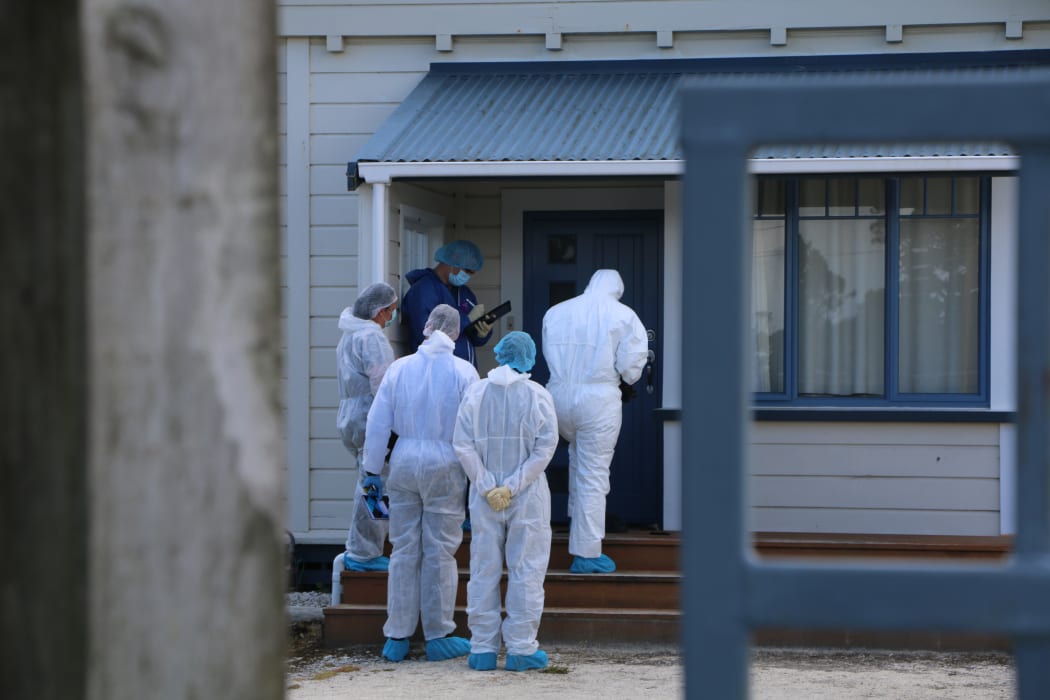 Investigators at the Taranaki home that is the focus of a double homicide inquiry.