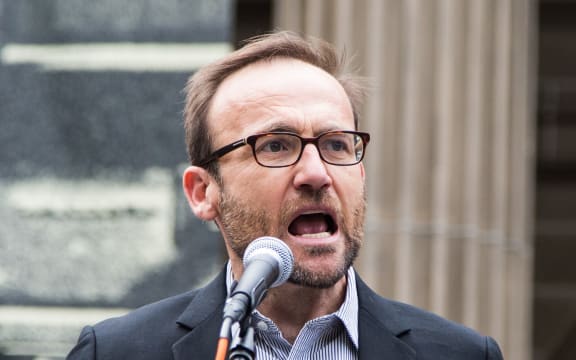 Green Party MP Adam Bandt addresses the crowd during a protest against US President Donald Trump and Australian Prime Minister Malcolm Turnbull and their Immigration and Refugee policies in Melbourne.