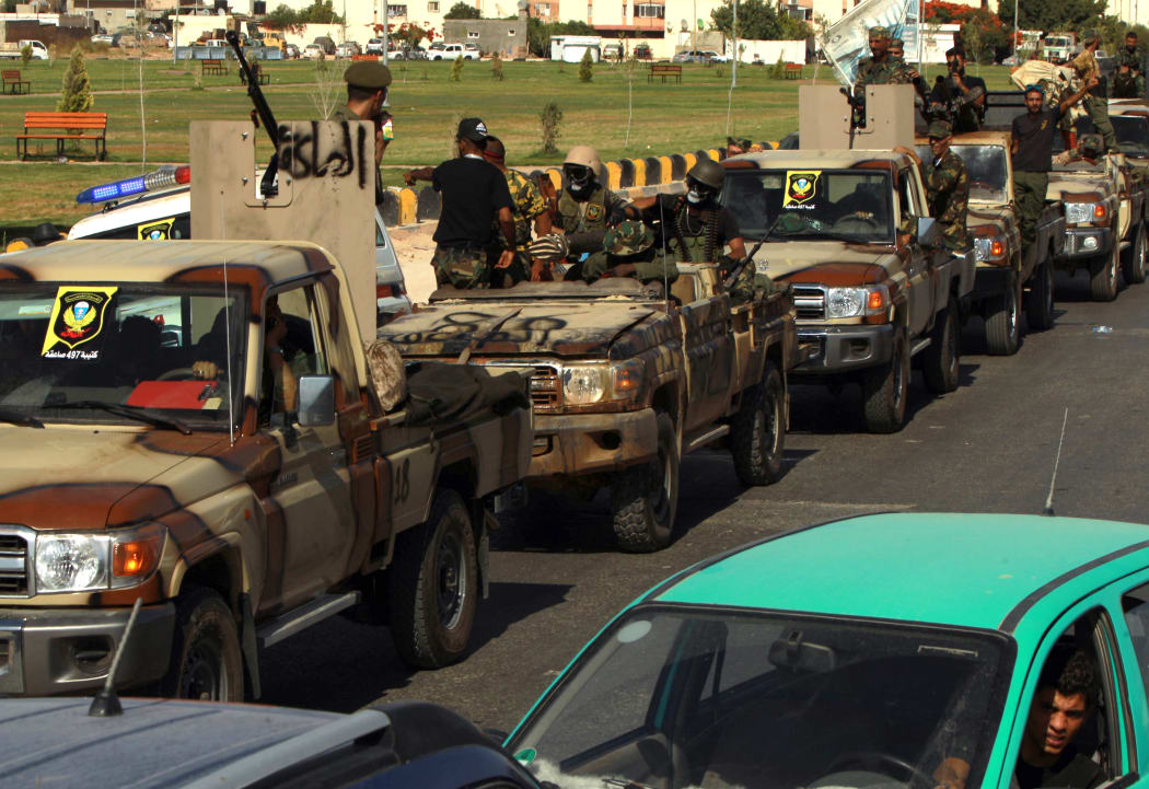 Members of the self-proclaimed eastern Libyan National Army (LNA) special forces gather in the city of Benghazi on June 18, 2020.