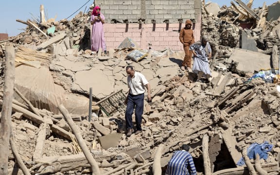 Villagers inspect the rubble of collapsed houses in Tafeghaghte, 60 kilometres southwest of Marrakesh, on 10 September, 2023, two days after a devastating 6.8-magnitude earthquake struck the country.