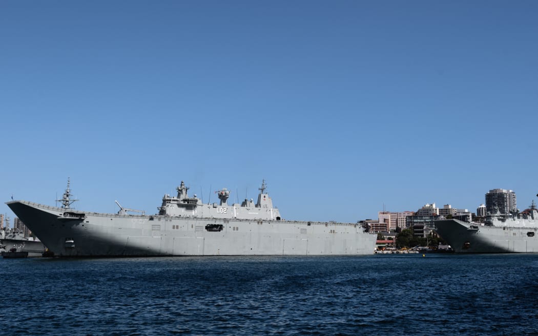Australia - 02/23/2019 - ARCHIVE, NEW INTERNATIONAL MILITARY PACT - Ships HMAS Canberra (L 02) and HMAS Adelaide (L 01) are seen docked at a port in Sydney, Australia, on February 23, 2019, in photo of file. Australia, the United Kingdom and the United States announced a new military pact, the AUKUS, following concerns about China's growing military presence in the Pacific and Indian Oceans. Photo: Ettore Chiereguini/AGIF (Photo by Ettore Chiereguini / AGIF / AGIF via AFP)