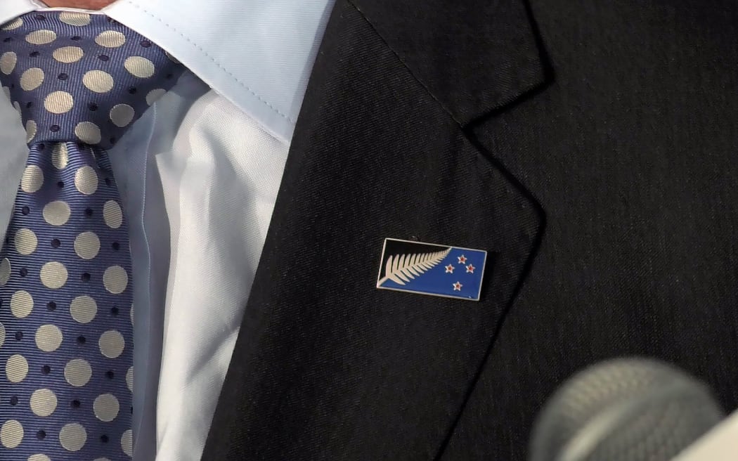 John Key's lapel with a close up of the Kyle Lockwood flag