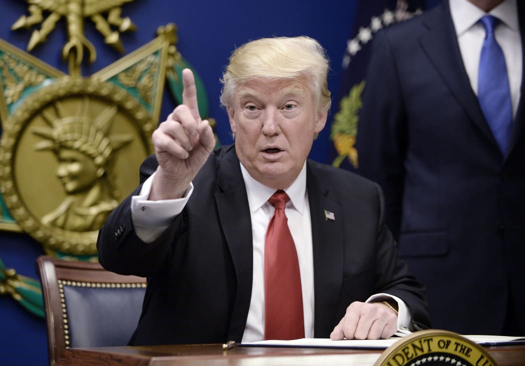 President Donald Trump signs Executive Orders in the Hall of Heroes at the Department of Defense in Virginia.