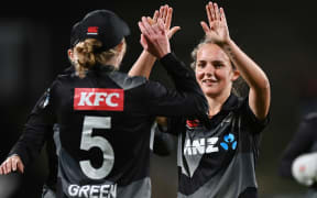 Amelia Kerr celebrates the wicket of Meg Lanning with Maddy Green
New Zealand White Ferns v Australia International Twenty20 cricket match. Seddon Park, Hamilton New Zealand. Sunday 28 March 2021. Â© Copyright photo: Andrew Cornaga / www.photosport.nz