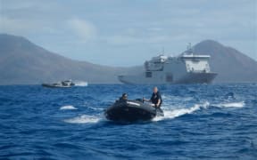 The Marine Survey Team taking Zodiacs ashore with military and USAR reps, then following up with food and water.