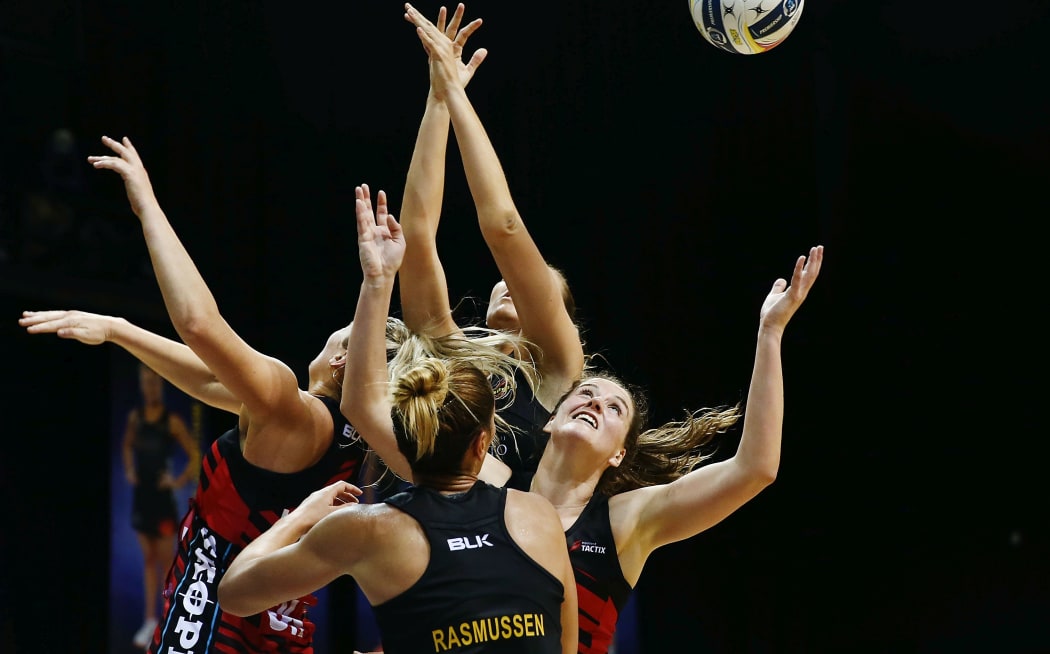 Jessica Moulds of the Tactix competes for the rebound against Lenize Potgieter and Grace Rasmussen.