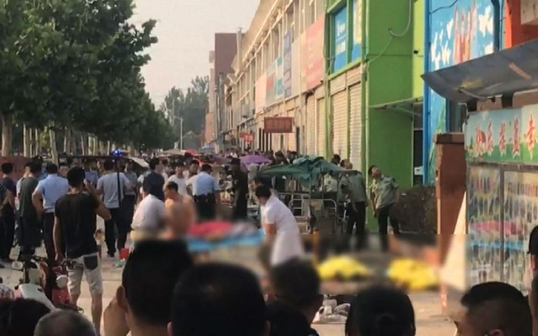 This screengrab taken from a broadcast by China's State broadcaster CCTV  shows the aftermath of an explosion outside a kindergarten in the eastern Chinese city of Xuzhou.
