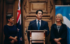 Outgoing National leader Simon Bridges, flanked by his deputy leader Paula Bennett and his wife Natalie Bridges, gives his resignation speech.