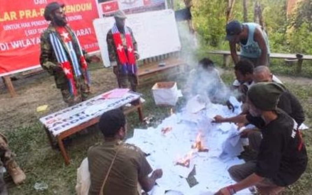 West Papua National Committee members burning voting papers for the Indonesian presidential election.