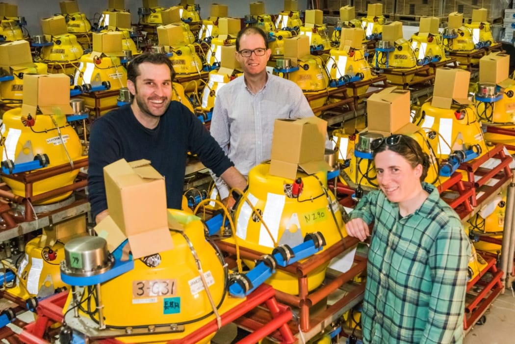 Scientists Dan Bassett, Dan Barker, and Katie Jacobs, all of GNS Science, with some of the recording instruments that will be placed on the seafloor off the East Coast as part of the project to study the Hikurangi subduction zone.