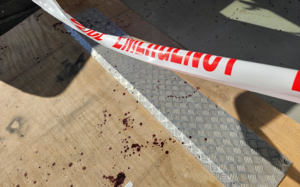 Blood stains and blood-trail throughout the flooring of a container walkway outside a construction site on Alexandra Street after a fatal fight in Hamilton.