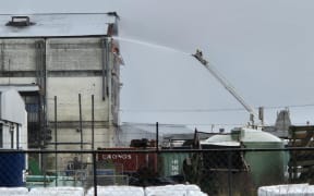 Thirteen fire crews are working to extinguish a blaze at an industrial estate near Hastings.
