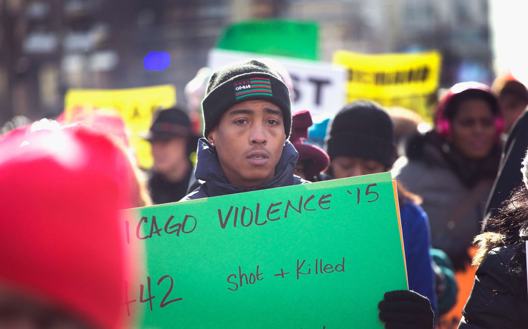 Demonstrators in Chicago call for mayor Rahm Emanuel's resignation over the police killings of Quintonio LeGrier, Bettie Jones and Laquan McDonald.