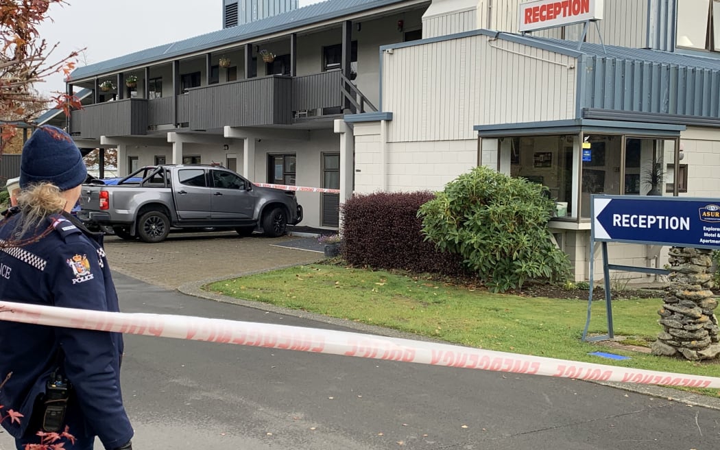 Police at the Explorer Motel and Apartments in Te Anau, where the body of a woman was found.