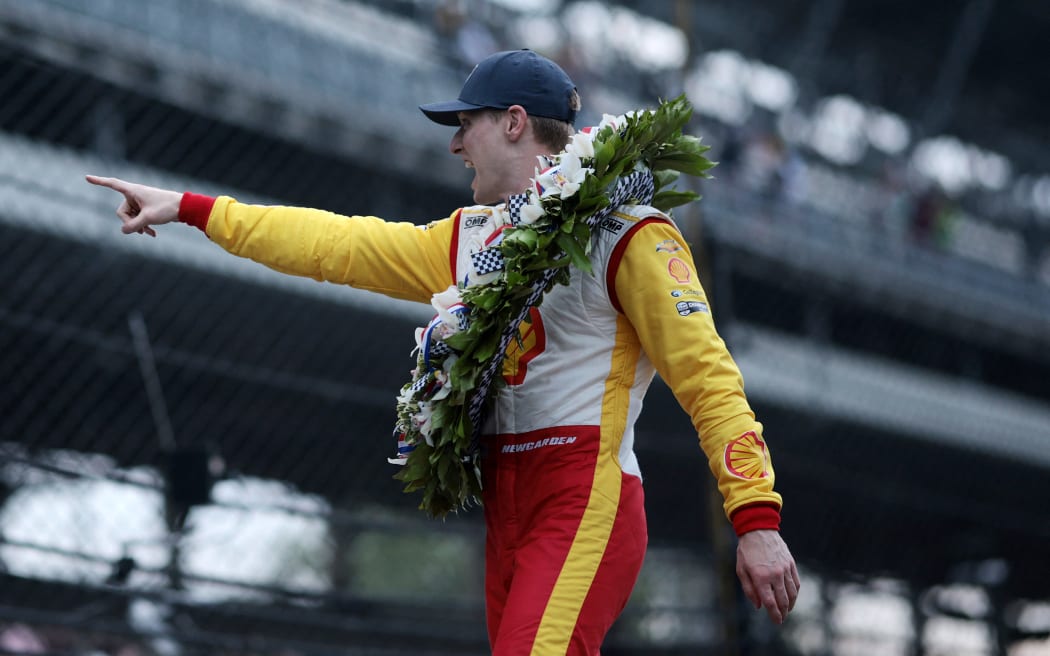 INDIANAPOLIS, INDIANA - MAY 26: Josef Newgarden, driver of the #2 Shell Powering Progress Team Penske, celebrates ion the yard of bricks after winning the 108th Running of the Indianapolis 500 at Indianapolis Motor Speedway on May 26, 2024 in Indianapolis, Indiana.   James Gilbert/Getty Images/AFP (Photo by James Gilbert / GETTY IMAGES NORTH AMERICA / Getty Images via AFP)