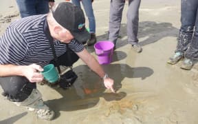 Greg Browne points to a newly discovered footprint.